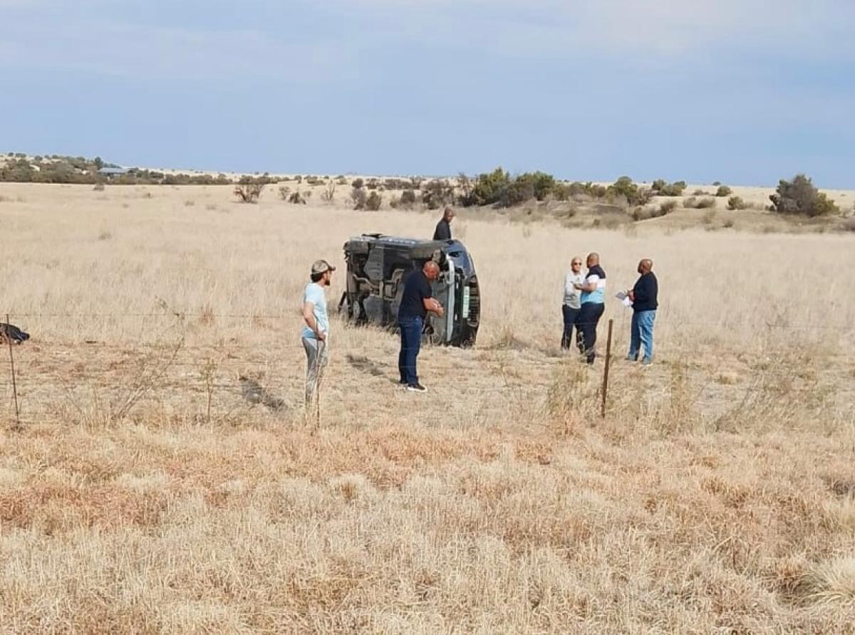 Unknown individuals observing the accident scene. Picture: Supplied